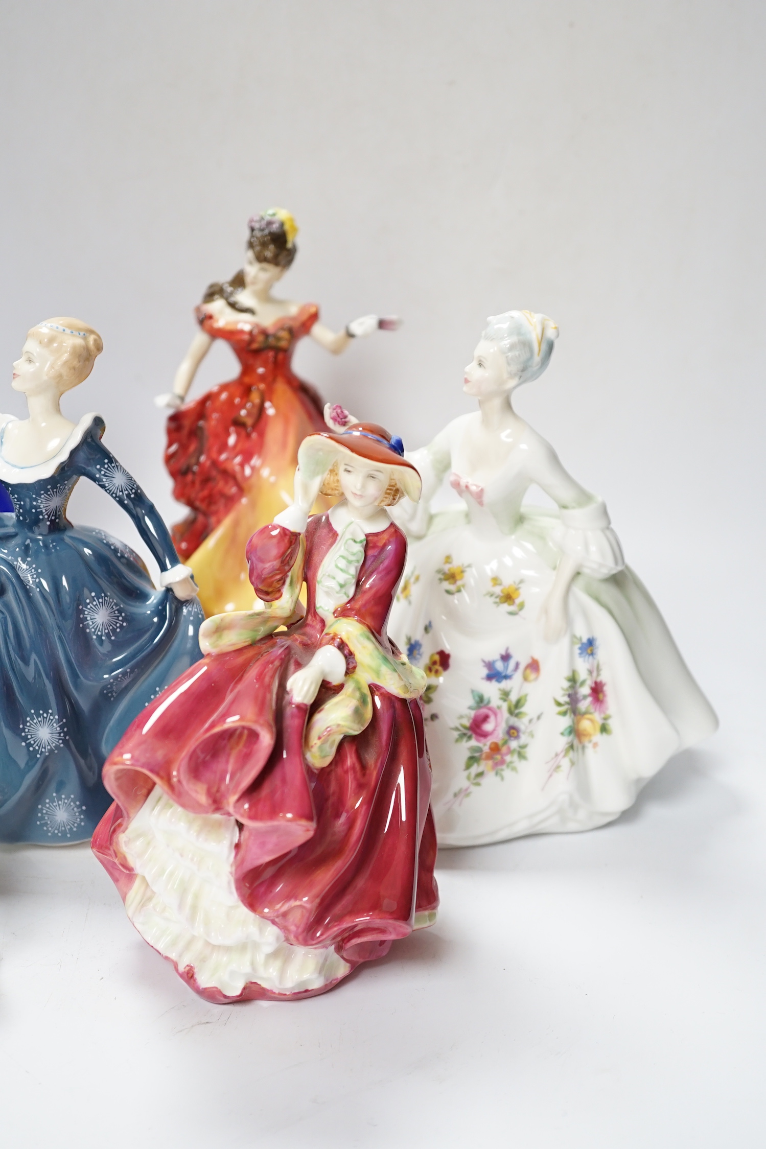 Seven Royal Doulton figurines, (two boxed), tallest 21cm